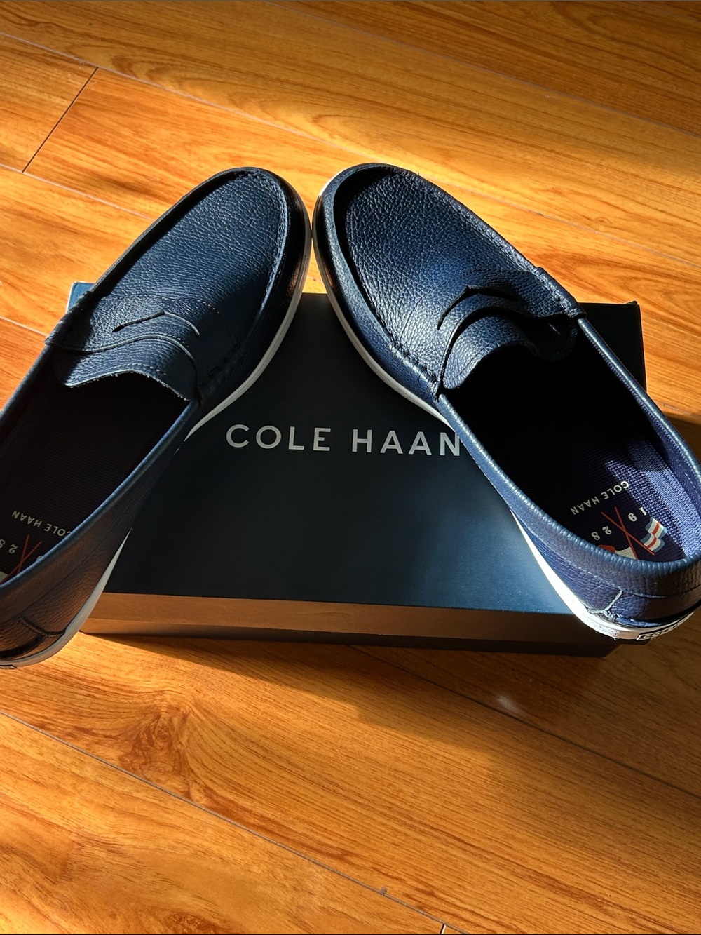 Cole Haan Navy Pebbled Leather Penny Loafers with White Sole